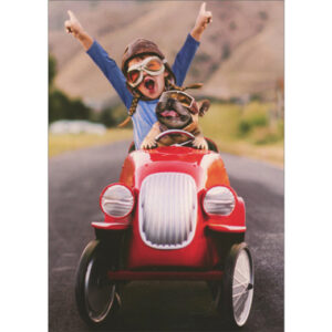 KID AND DOG DRIVING PEDDLE CAR GRADUATIO